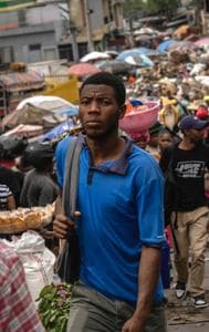  People walk through a street market in Port-au-Prince, Haiti, April 26, 2024. 